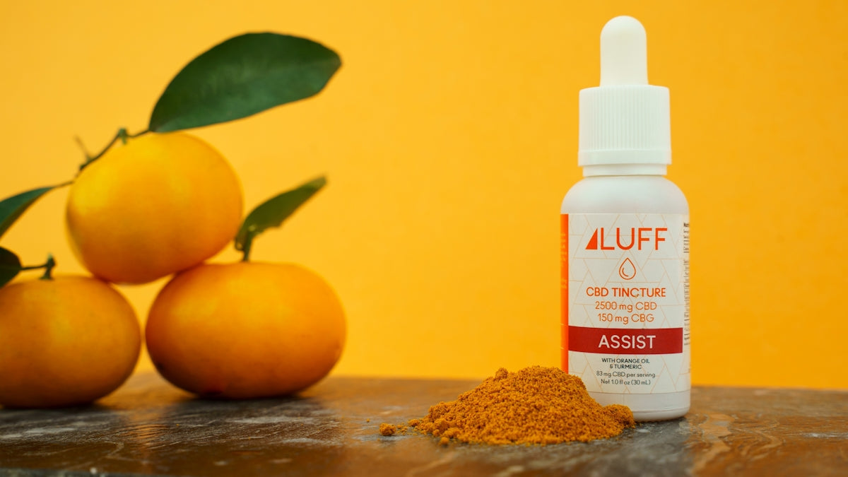 white plastic bottle beside orange fruit