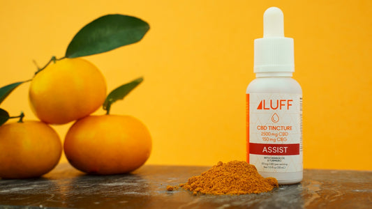 white plastic bottle beside orange fruit