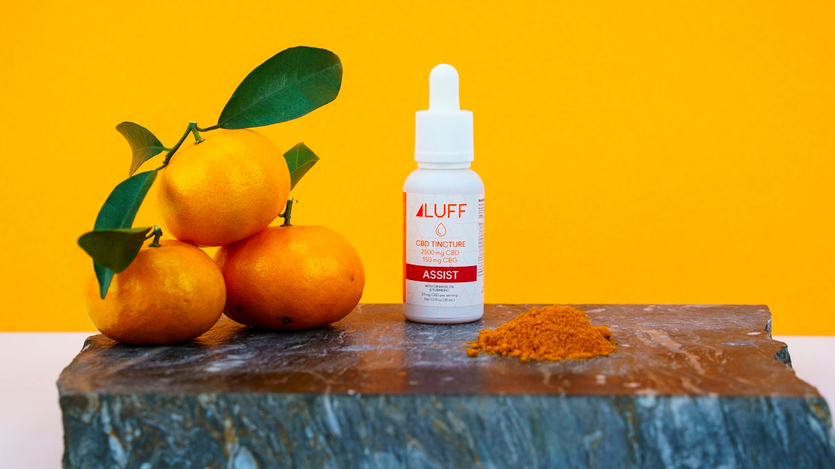 white plastic bottle beside yellow citrus fruits