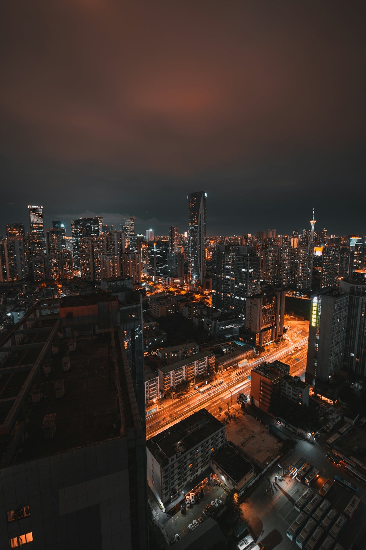 a view of a city at night from the top of a building