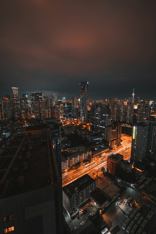 a view of a city at night from the top of a building