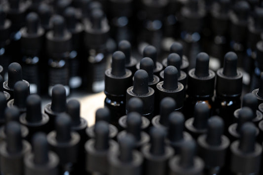 a bunch of black plastic caps sitting on top of a table