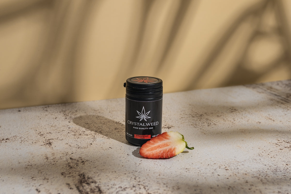 a can of strawberry jam sitting on a counter