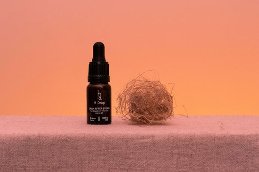 a bottle of wine next to a pile of hay