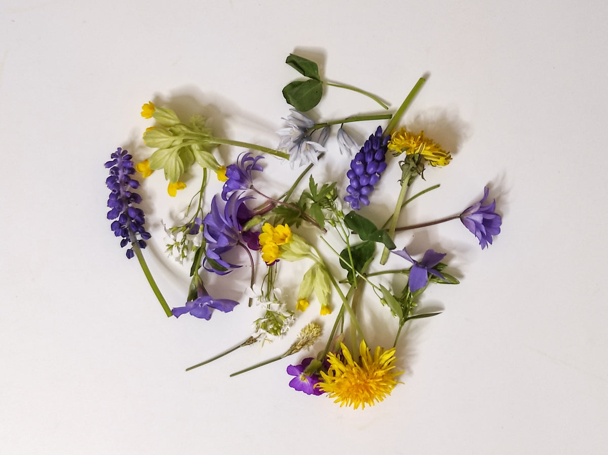 a bunch of flowers that are on a table
