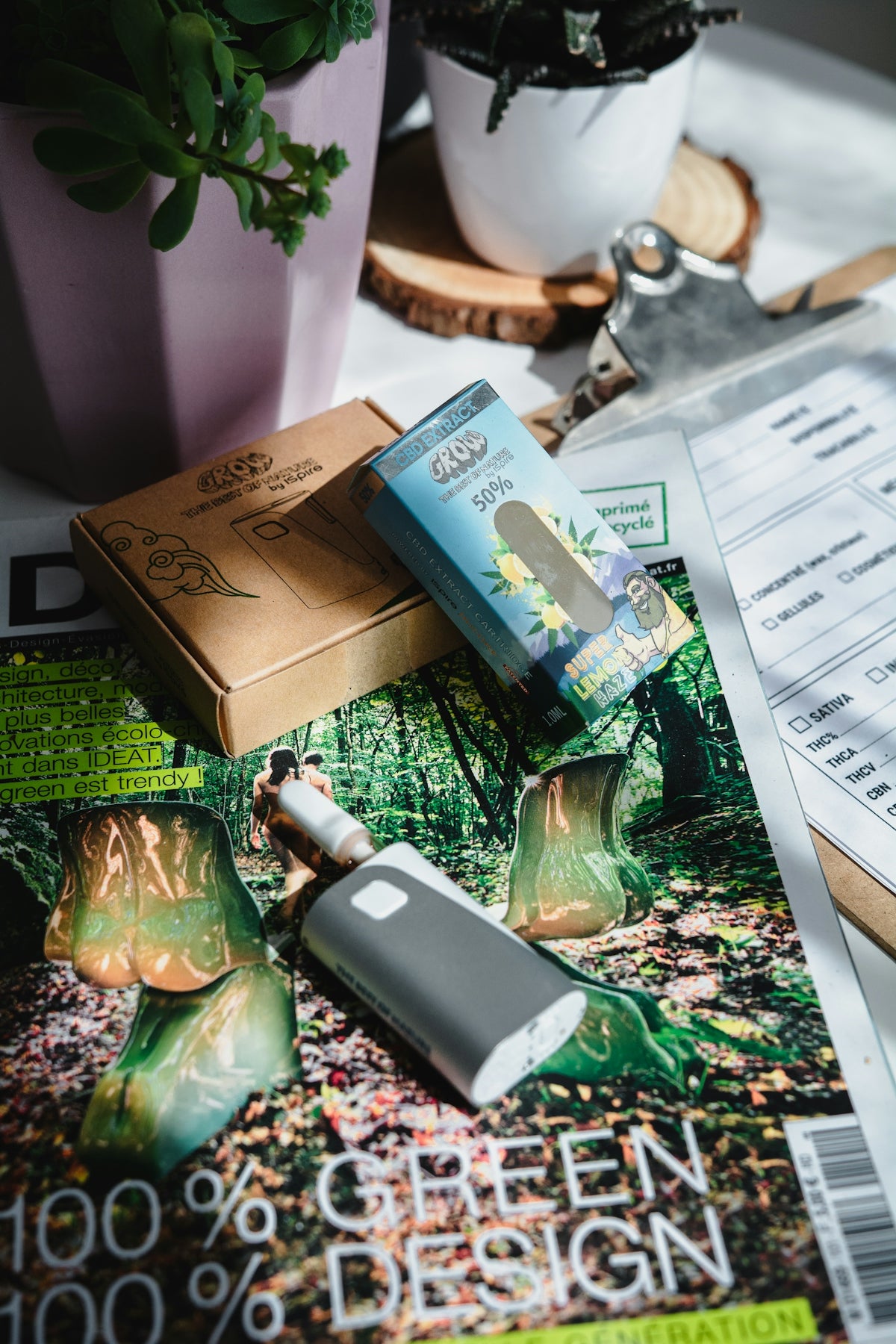 A table topped with a magazine and a cell phone