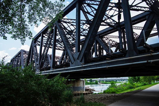 A bridge over a river with a road going underneath it