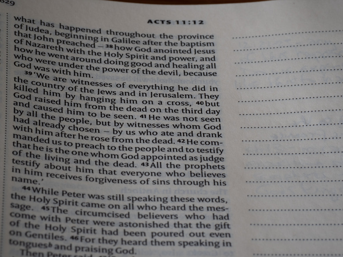 A close up of an open book with writing on it