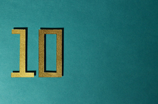 The number 10 is gold on a teal background.