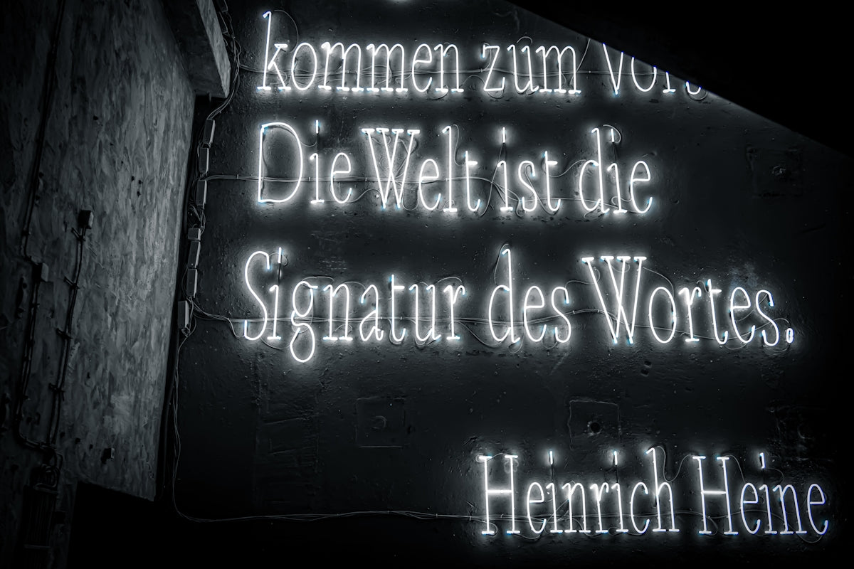 Neon sign with quote by heinrich heine