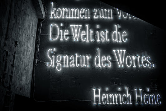 Neon sign with quote by heinrich heine